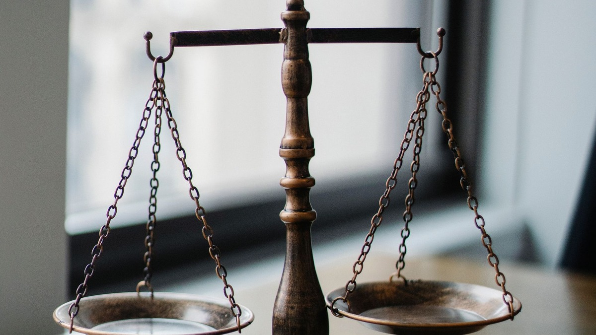 Scales of justice and gavel in a judge's office