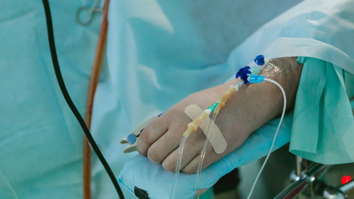 Patient in a hospital bed receiving emergency care