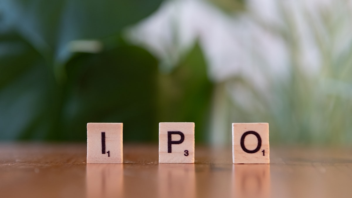 Wooden letter blocks spelling IPO on a table