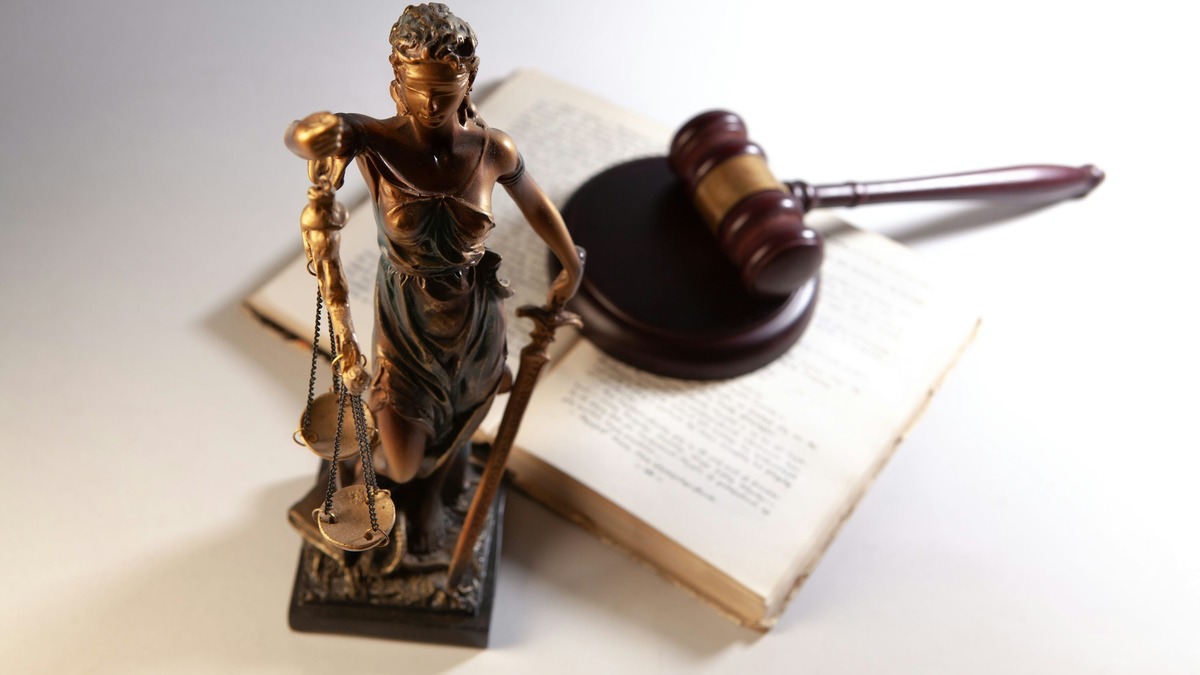 A gavel and open book on a table, symbolizing copyright litigation