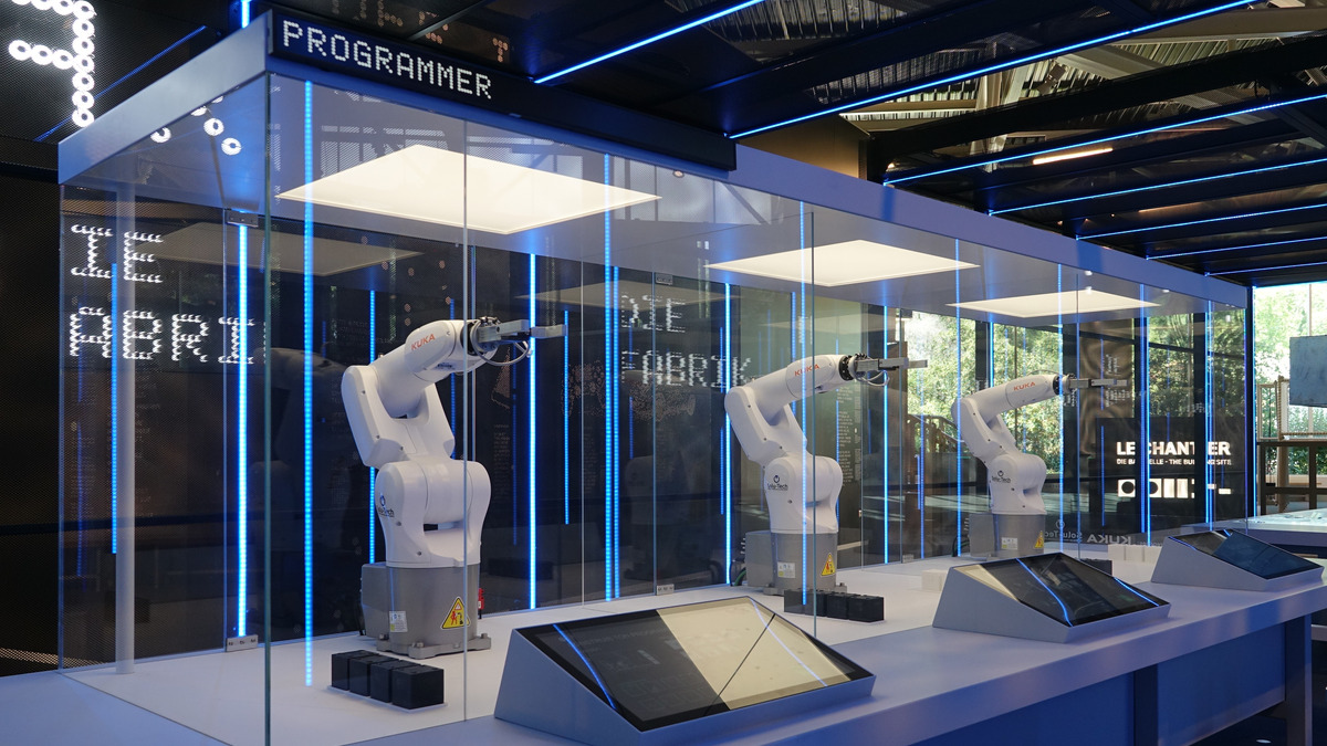 Industrial robotic arms on a factory floor