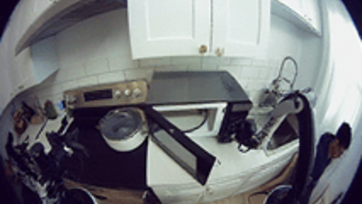 π0.7 navigating a kitchen environment during the air fryer demonstration