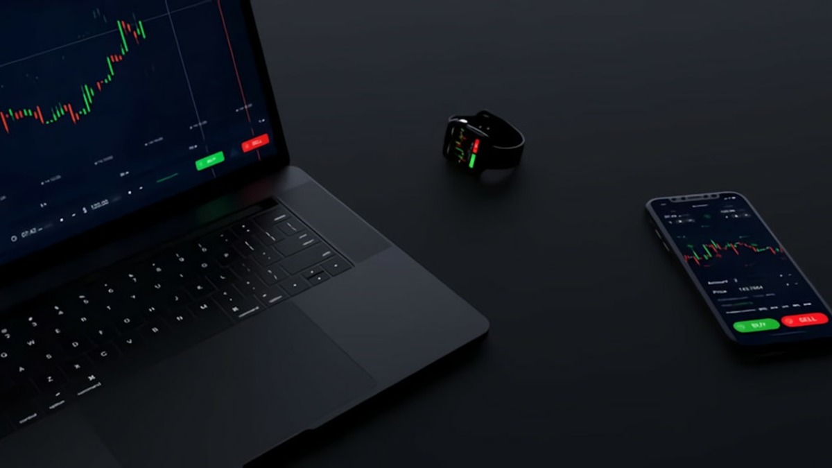 Financial analysis setup with laptop and trading data