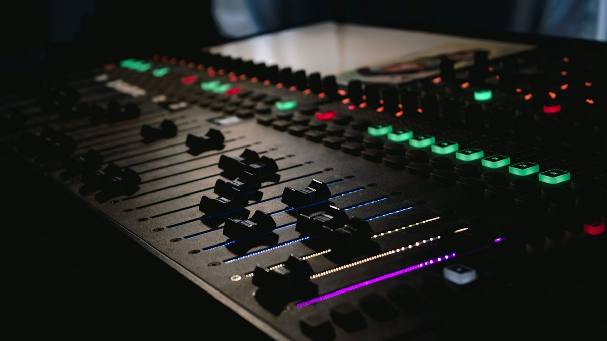 A professional audio mixing console in a recording studio