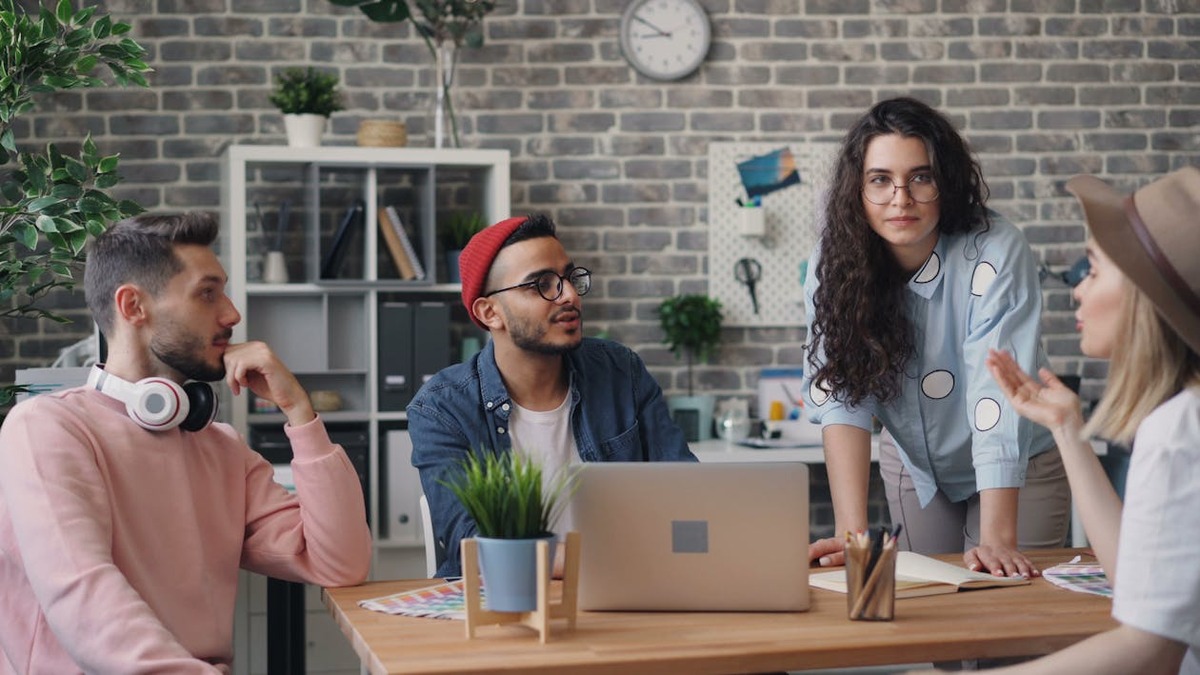 A professional office environment with workers collaborating