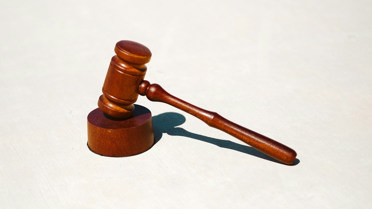A wooden gavel resting on a table