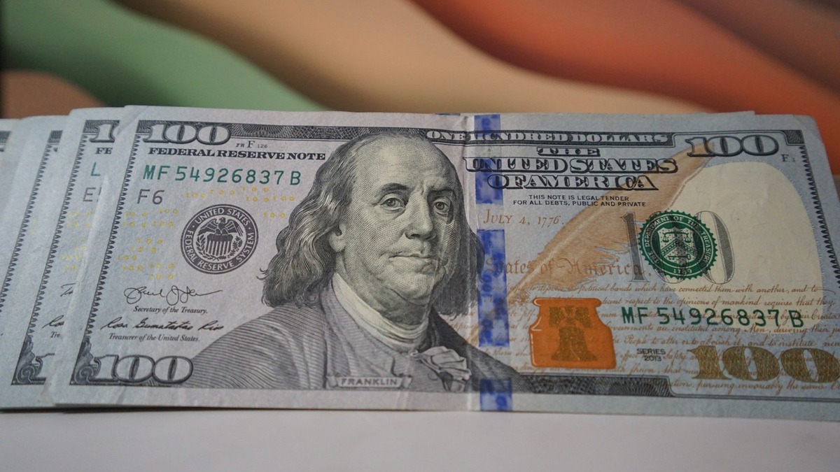 A stack of hundred dollar bills