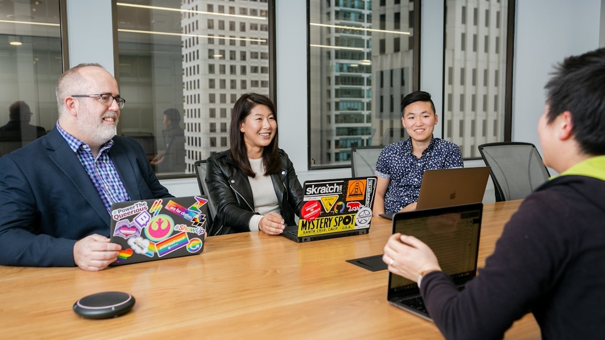 A team gathered around a table in a modern boardroom