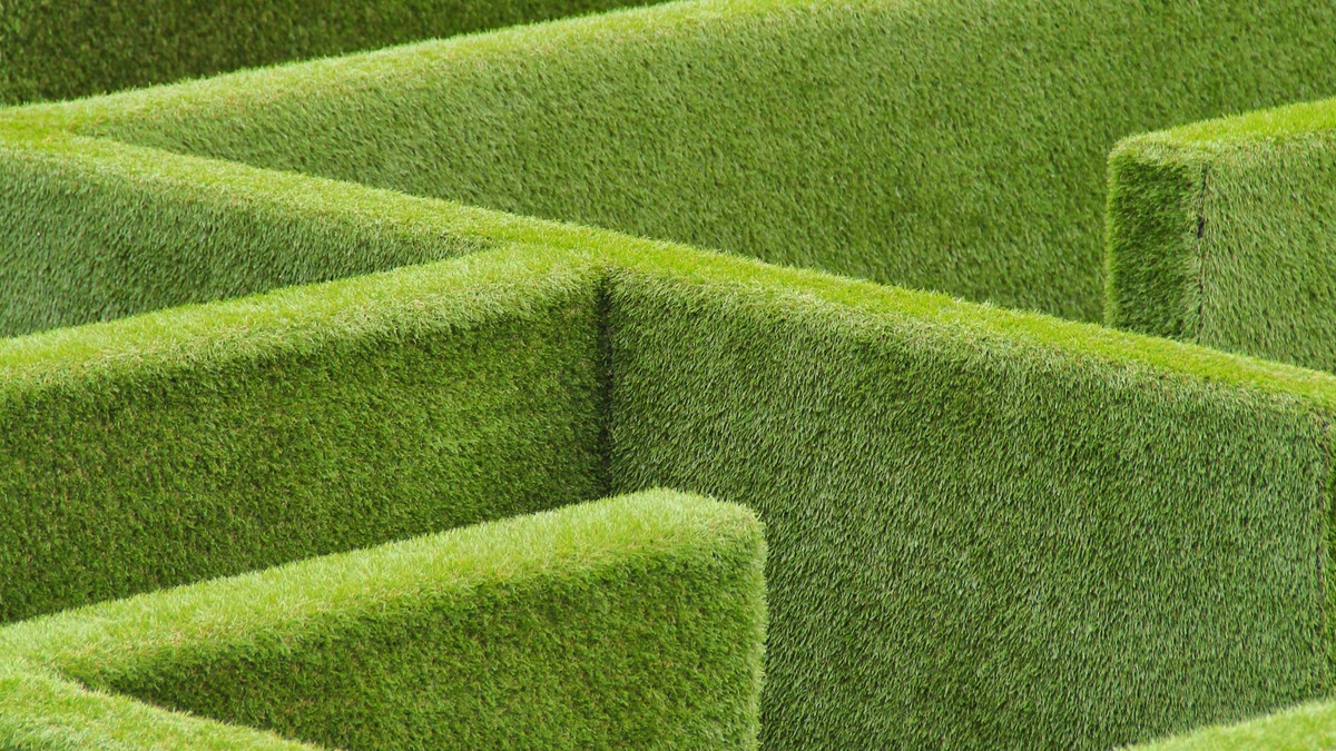Aerial view of a rectangular hedge maze with sharp green corners
