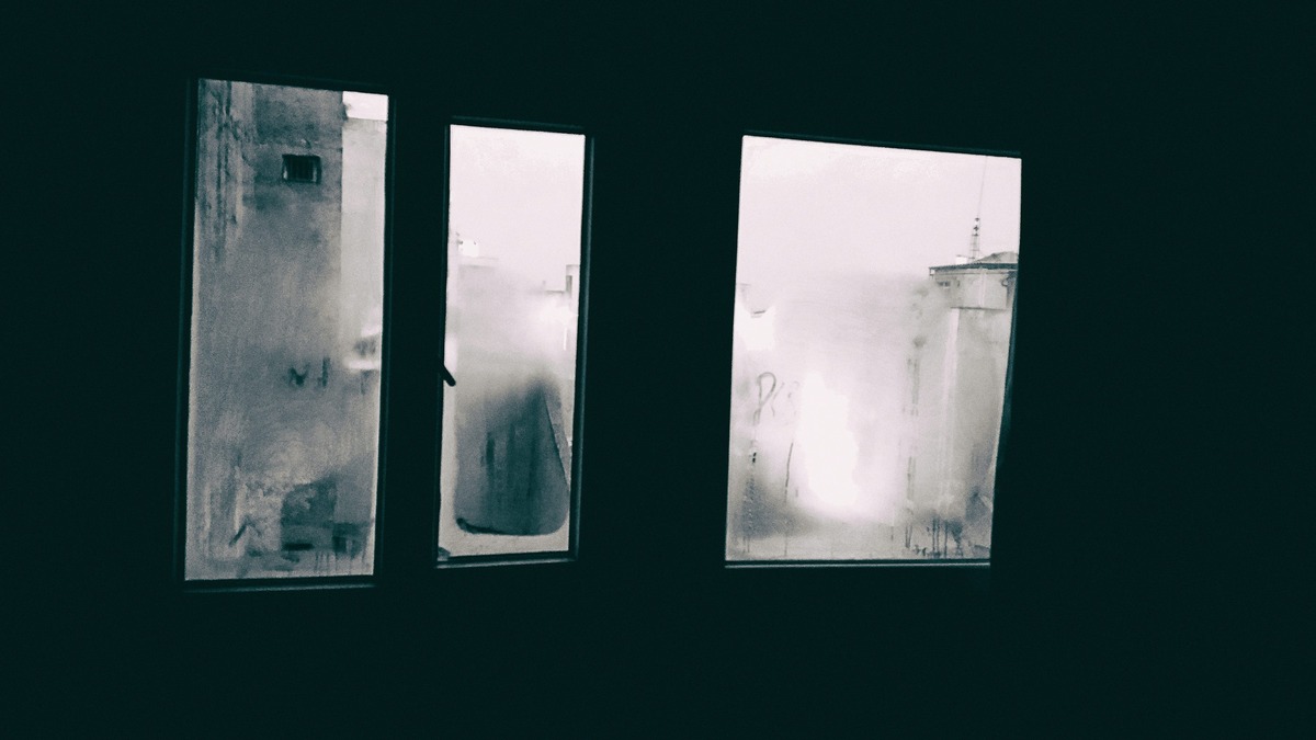 A foggy, obscured window at night
