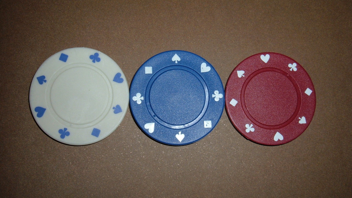 Poker chips on a green felt table