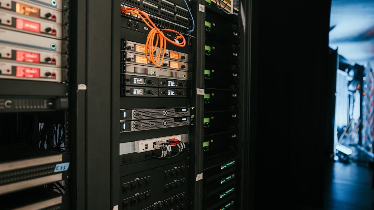 A server room with rows of rack-mounted servers representing shared GPU infrastructure
