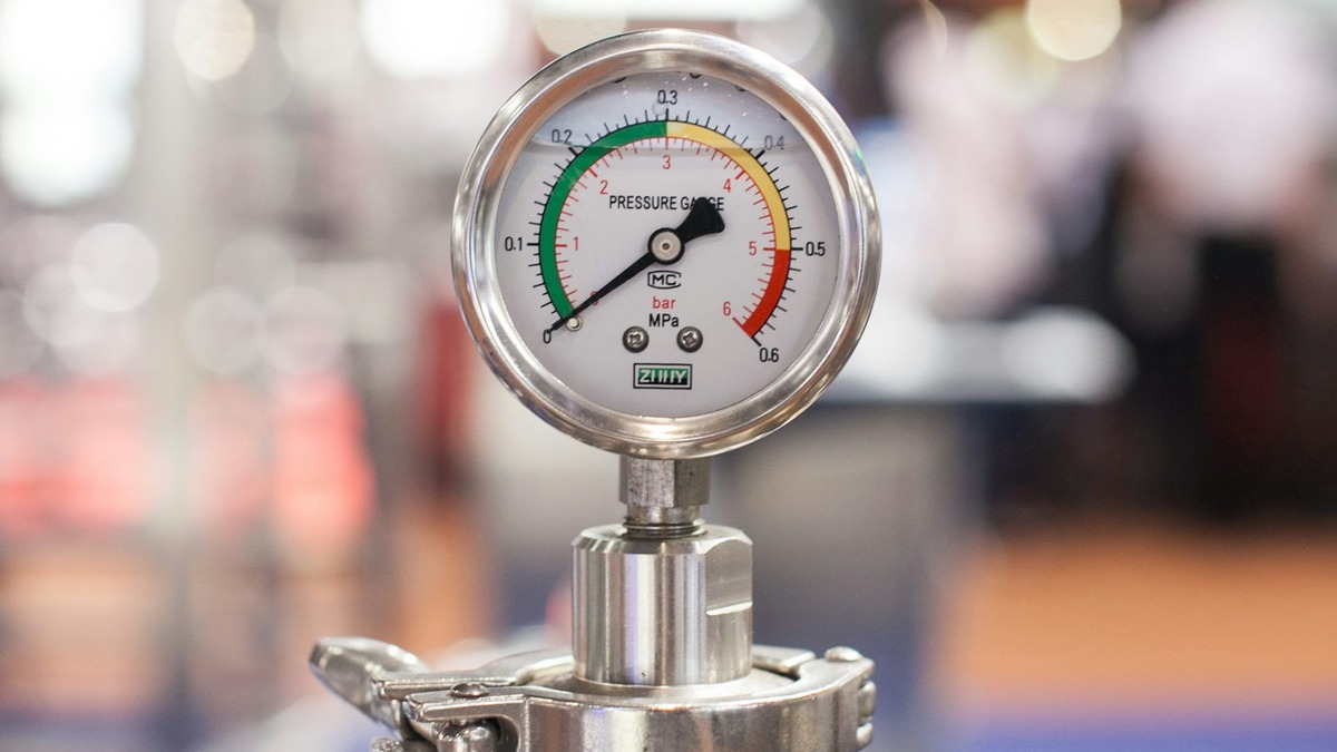 A pressure gauge with its needle pushed into the red zone