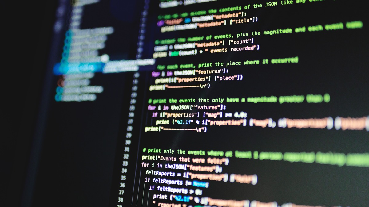 Colorful lines of code displayed on a dark computer monitor
