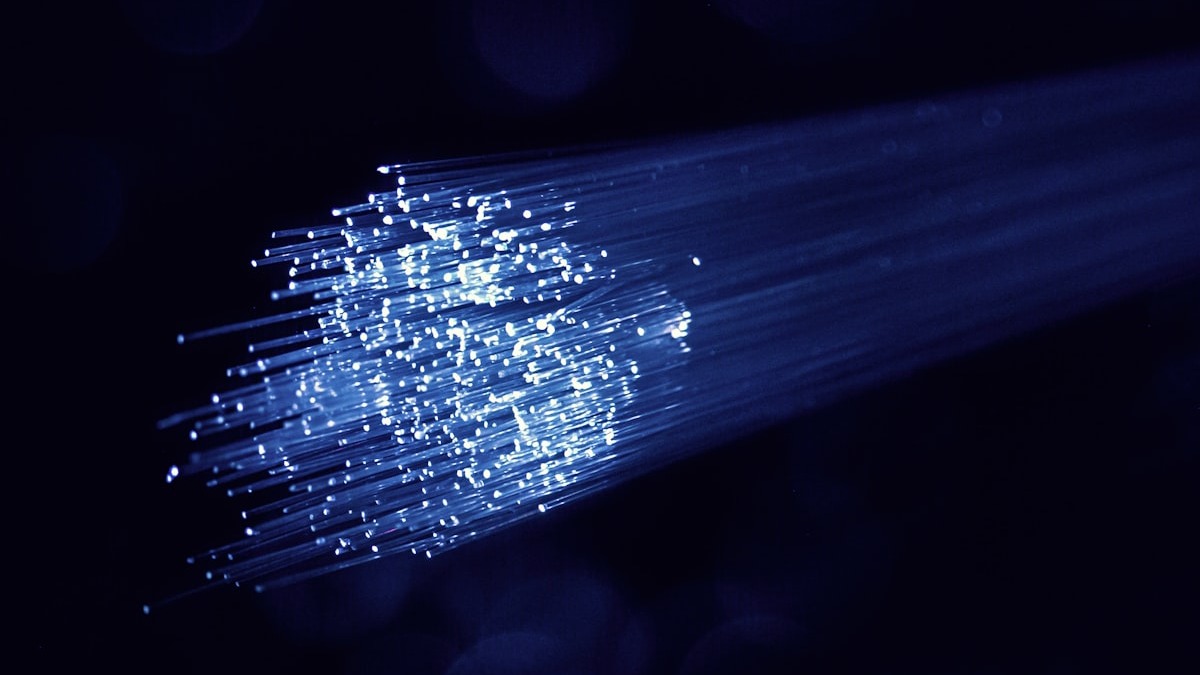 Blue fiber optic cables with glowing white light tips