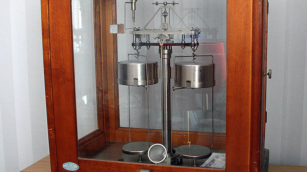 An analytical balance scale on a laboratory bench