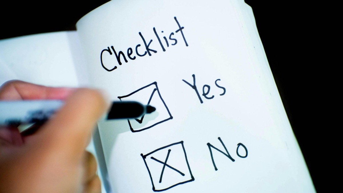 A clipboard with a checklist on a desk, representing structured evaluation and review processes