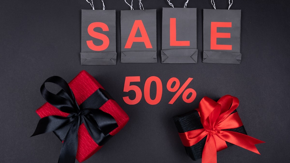 Person using a laptop browser with multiple tabs open for research tasks