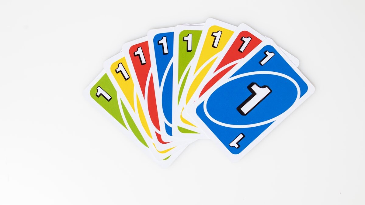 Colorful paper study flashcards arranged on a desk with a pencil