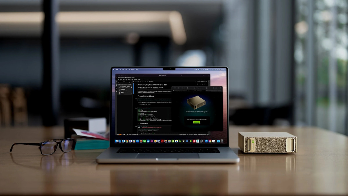 NVIDIA DGX Spark on a desk next to MacBook Pro running fine-tuning notebooks