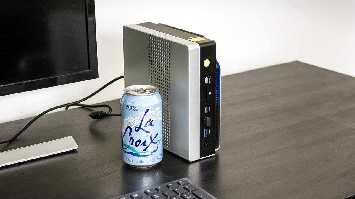 GMKtec EVO-X2 AI Mini PC next to a La Croix can for size reference