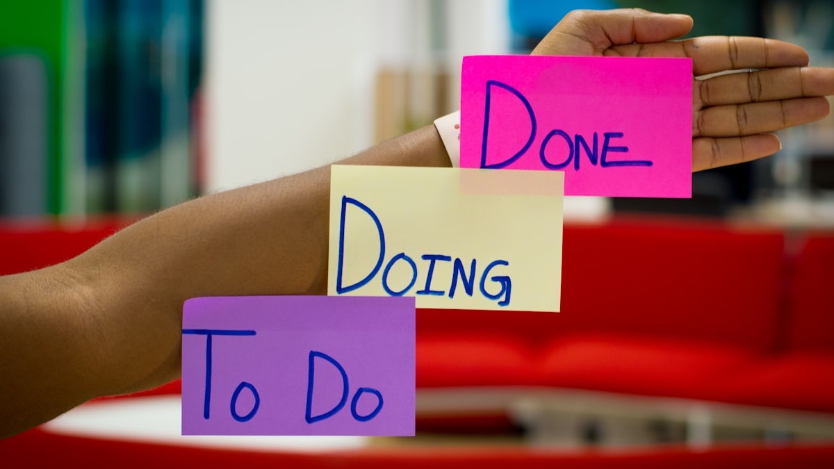 A project management kanban board showing tasks organized in swimlanes