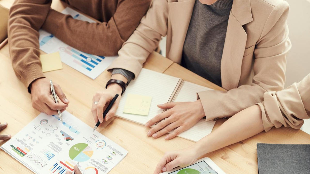A team reviewing AI prompt results and comparing outputs across a data table