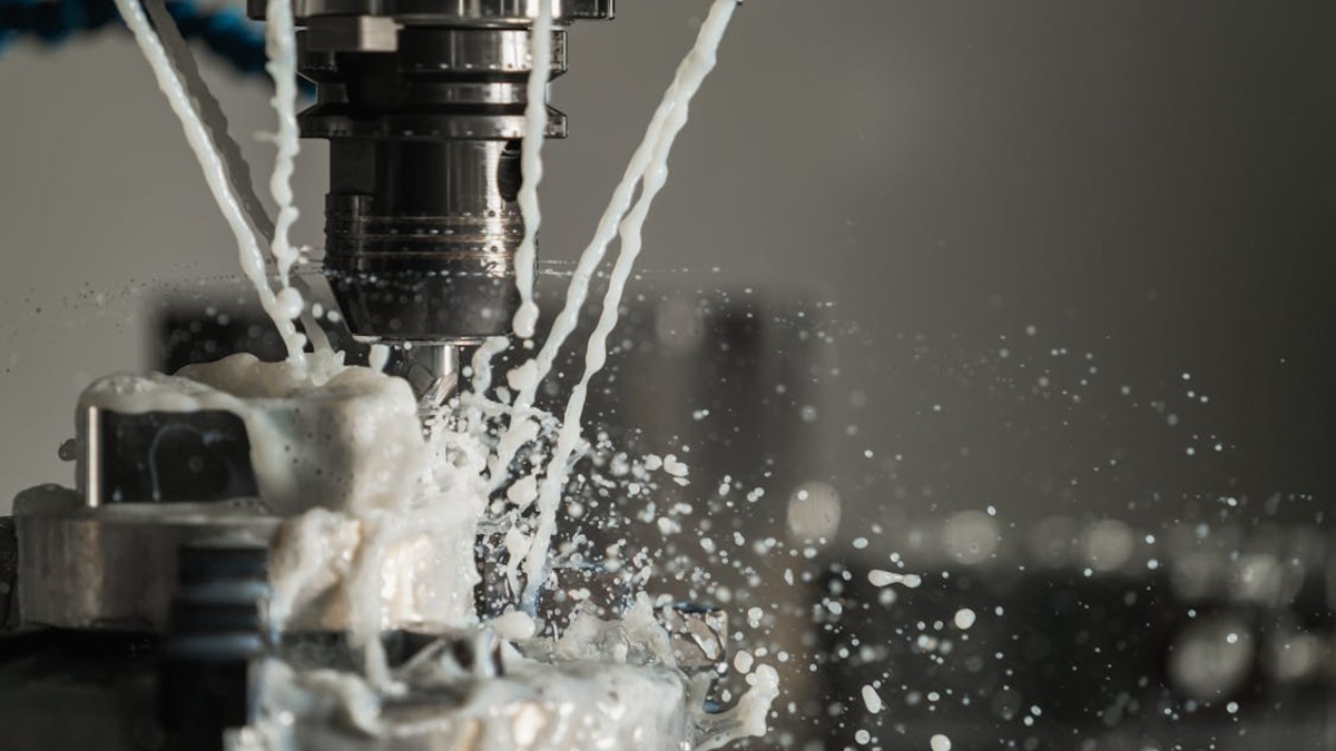 CNC machine with coolant during metalwork operation