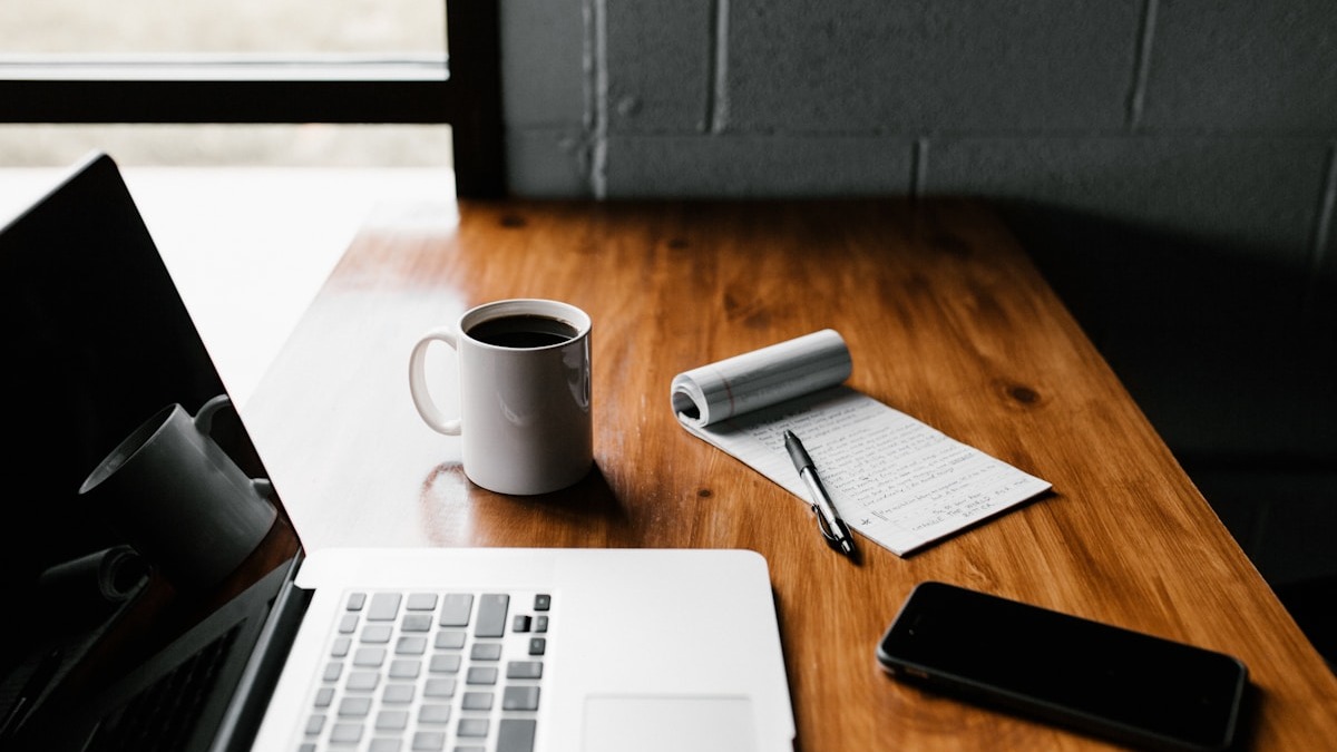 Professional person working on laptop researching B2B prospects
