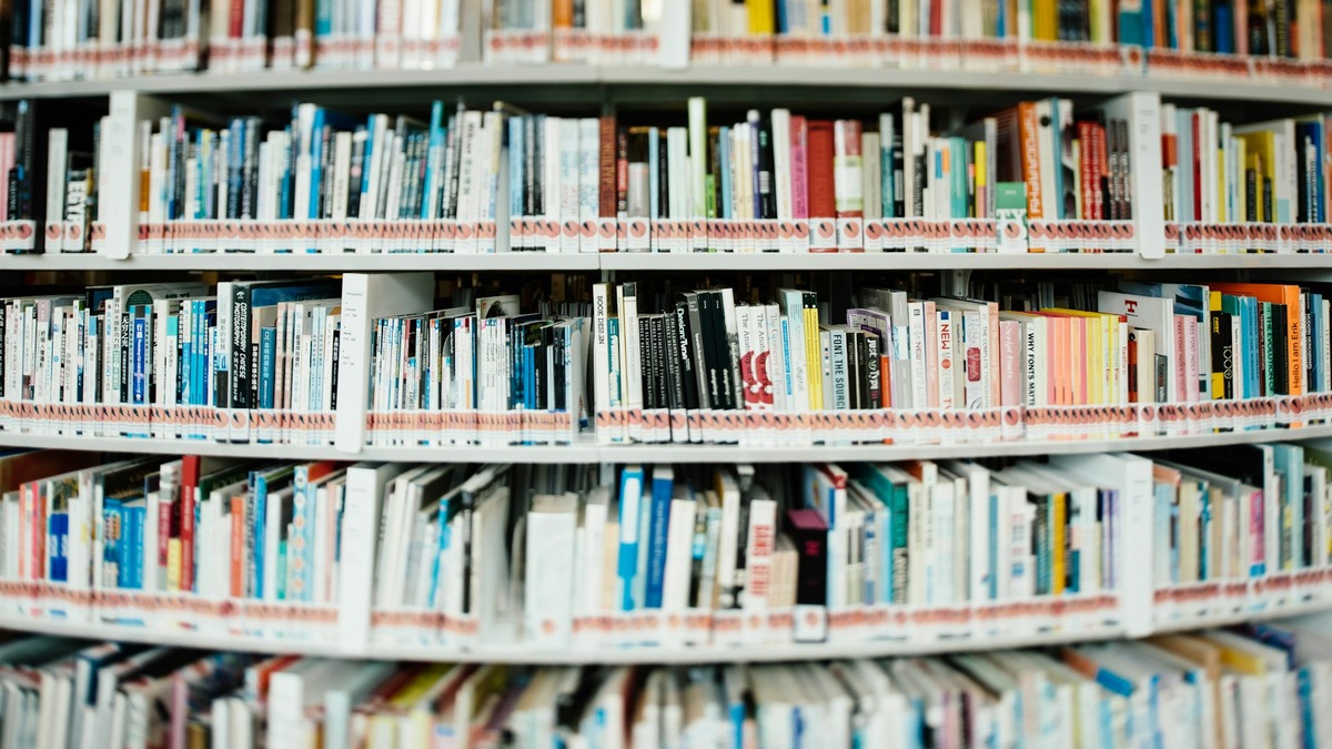A large library with tall stacks of books representing the vast amount of text 1M+ context windows can process
